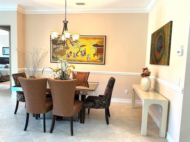 tiled dining area with a chandelier and ornamental molding