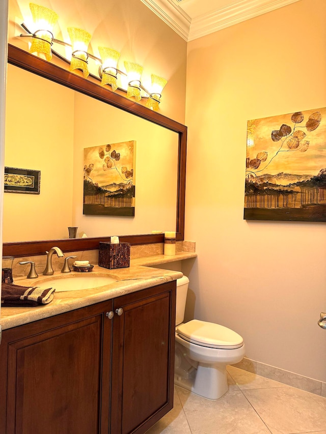 bathroom featuring vanity, toilet, tile floors, and crown molding