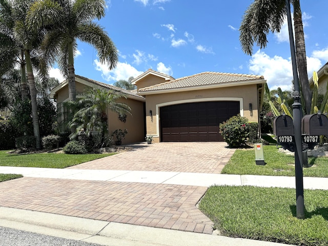 mediterranean / spanish-style house with a garage