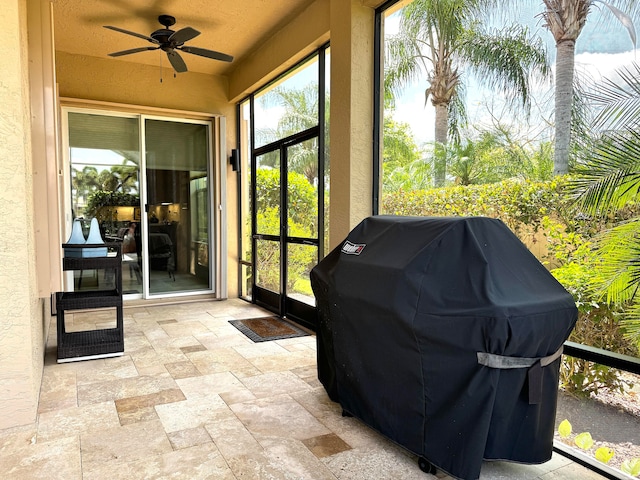 view of terrace featuring a grill and ceiling fan