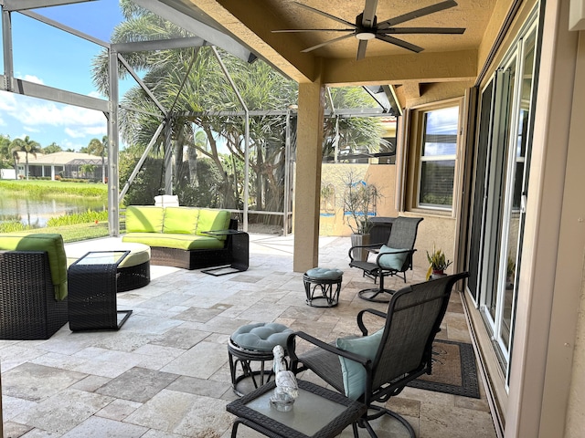 sunroom featuring a wealth of natural light and ceiling fan