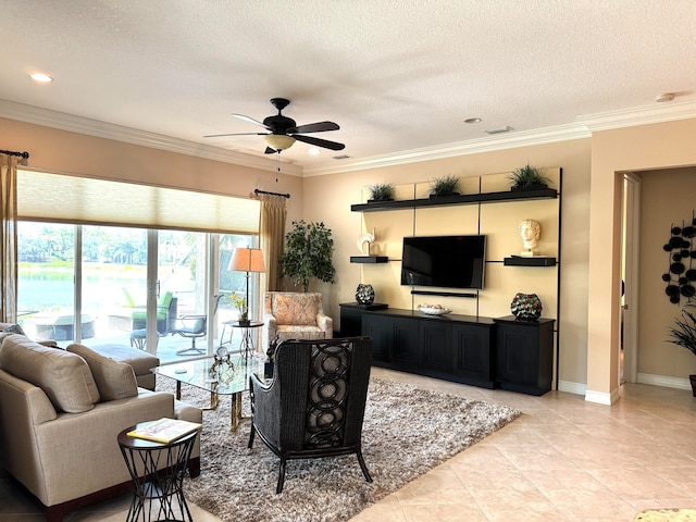 living room featuring a textured ceiling, ceiling fan, light tile floors, and crown molding