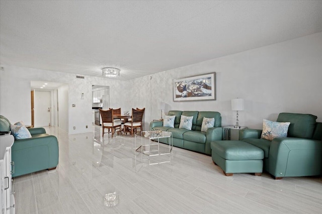 living room with a textured ceiling