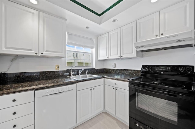 kitchen with electric range, dishwasher, and white cabinets