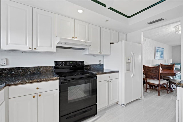 kitchen featuring white cabinetry, electric range, white refrigerator with ice dispenser, dark stone countertops, and light tile floors