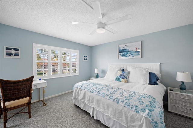 carpeted bedroom with a textured ceiling and ceiling fan