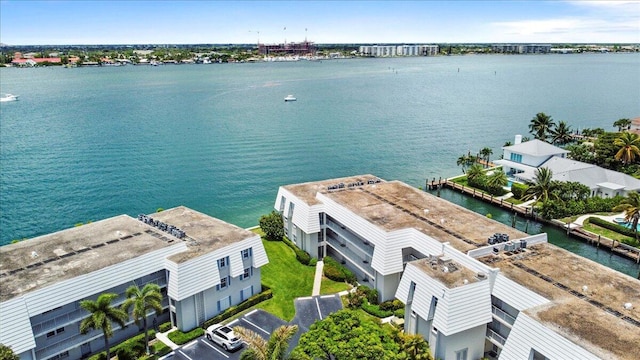 birds eye view of property with a water view