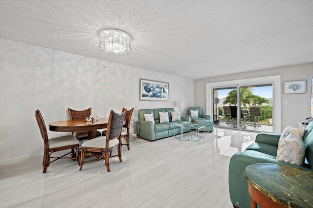 dining space featuring a textured ceiling