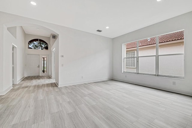 spare room with light hardwood / wood-style flooring