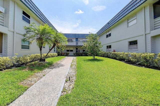 view of home's community featuring a lawn