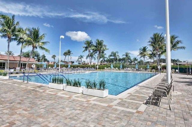 view of swimming pool featuring a patio area