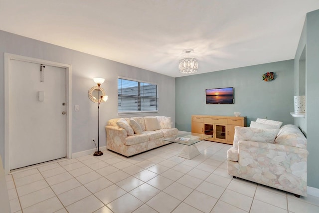 tiled living room featuring a chandelier