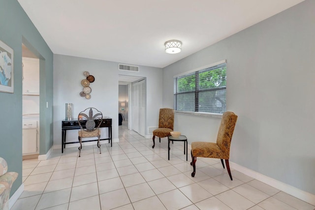 living area featuring light tile flooring