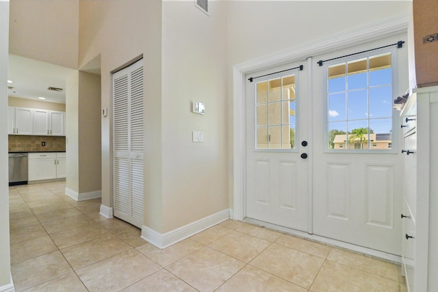 tiled entrance foyer with french doors