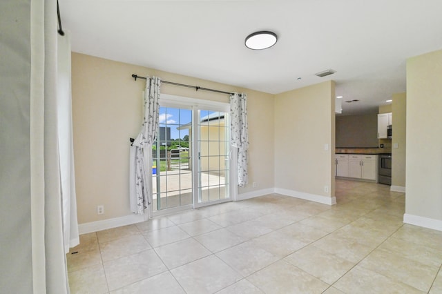 view of tiled spare room