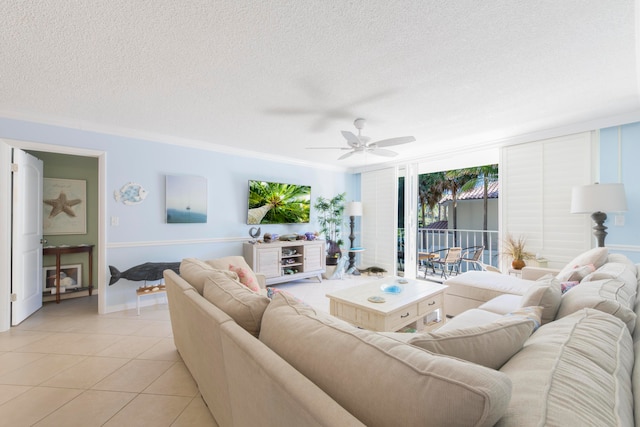 tiled living room with ceiling fan and a textured ceiling