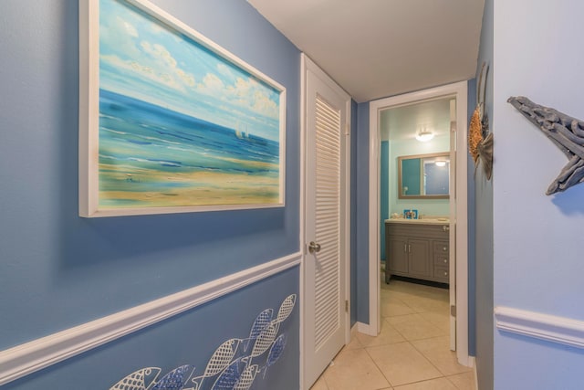 hallway featuring light tile flooring