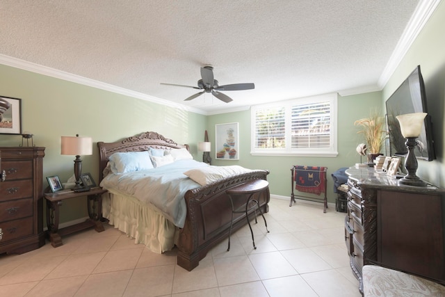 tiled bedroom with ornamental molding, ceiling fan, and a textured ceiling