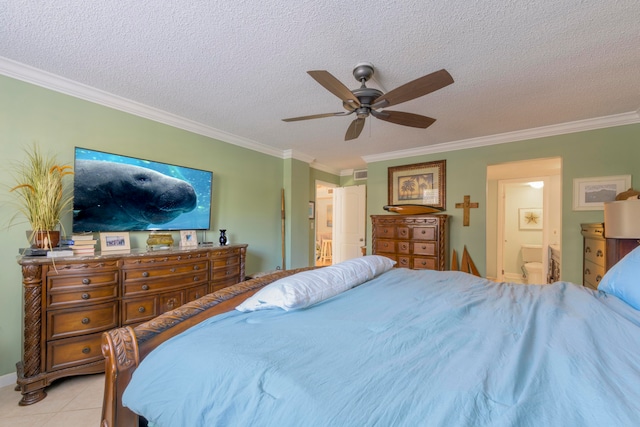 bedroom with ceiling fan, ensuite bath, a textured ceiling, light tile floors, and ornamental molding