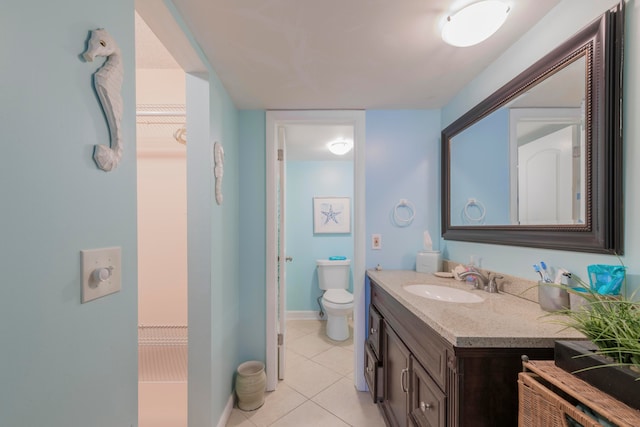 bathroom featuring tile floors, oversized vanity, and toilet