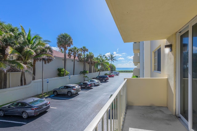 balcony featuring a water view