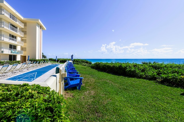 exterior space with a yard and a water view