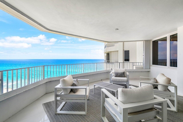 balcony featuring an outdoor hangout area and a water view