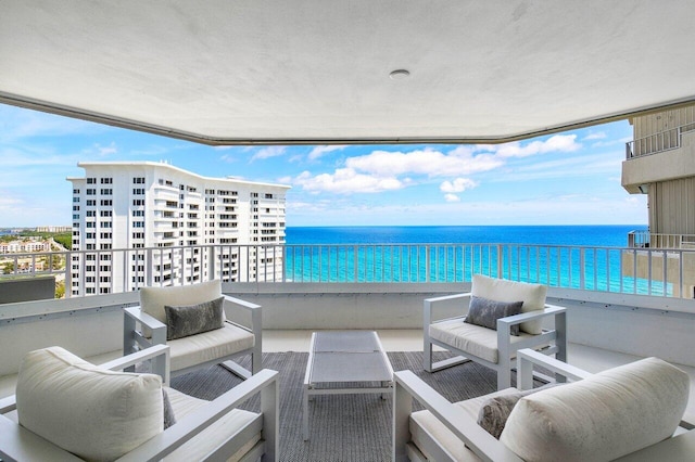 balcony featuring a water view