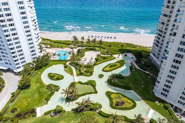 bird's eye view with a beach view and a water view