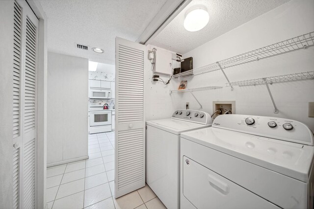 full bathroom with tile patterned floors, shower / bath combination with glass door, vanity, and toilet