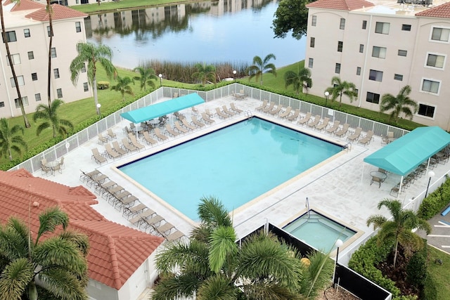 view of swimming pool with a water view