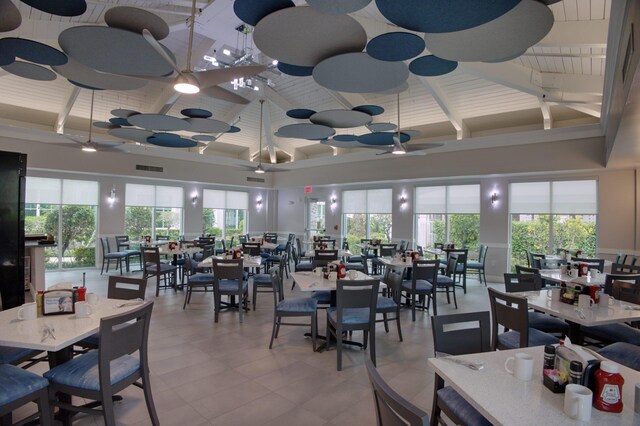 interior space with a drop ceiling, a tray ceiling, and hardwood / wood-style flooring