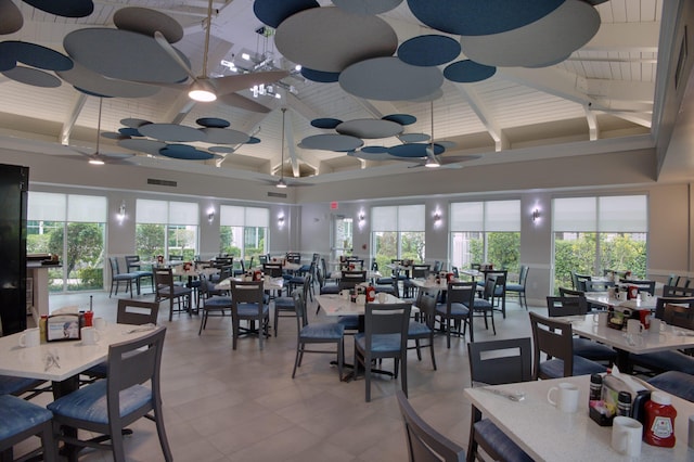 dining area featuring beamed ceiling, ceiling fan, and high vaulted ceiling