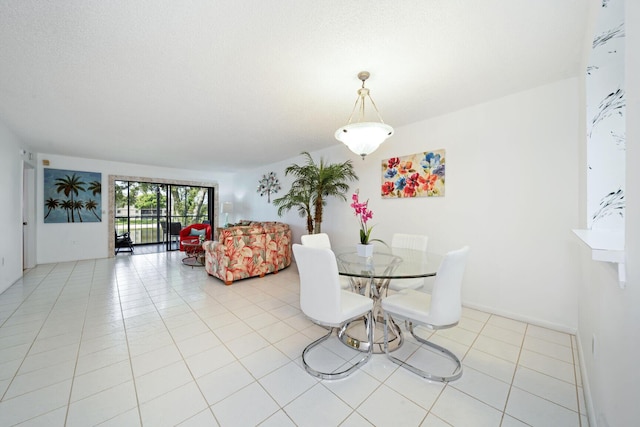 dining space featuring light tile patterned flooring