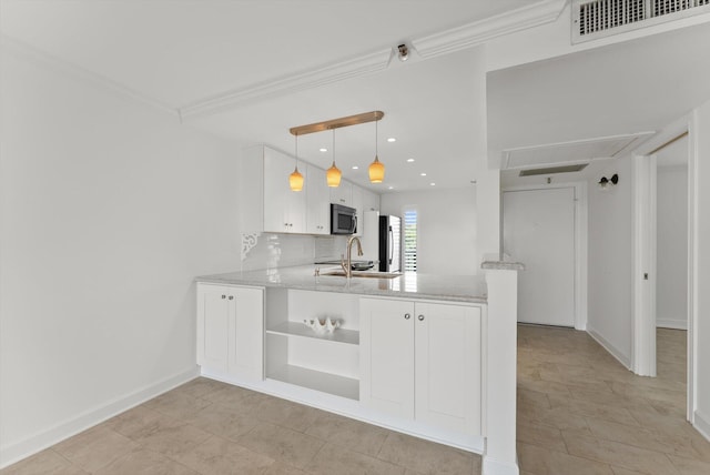 kitchen featuring appliances with stainless steel finishes, white cabinetry, light tile flooring, and kitchen peninsula