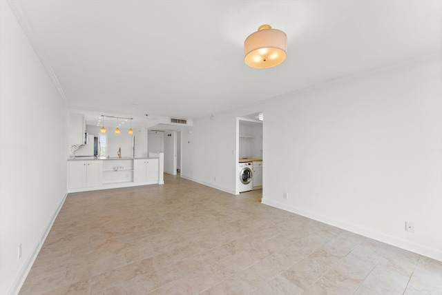 unfurnished living room with light tile flooring, crown molding, and washer / clothes dryer