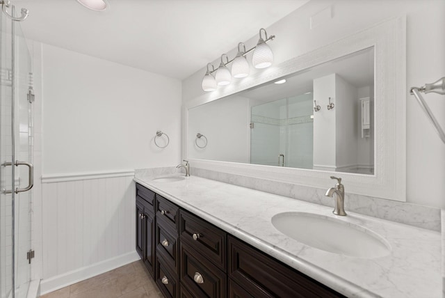 bathroom featuring walk in shower, tile flooring, and double sink vanity