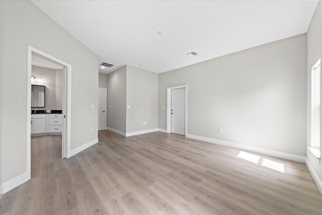 unfurnished room with light hardwood / wood-style floors