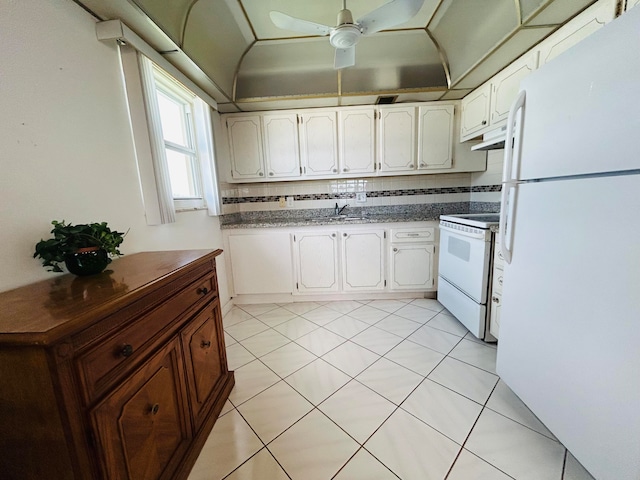 kitchen featuring ceiling fan, tasteful backsplash, white appliances, light tile flooring, and white cabinetry