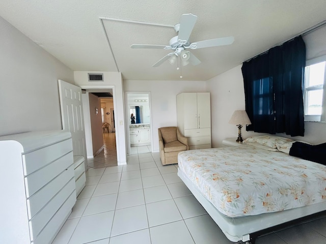 bedroom with ceiling fan and light tile floors