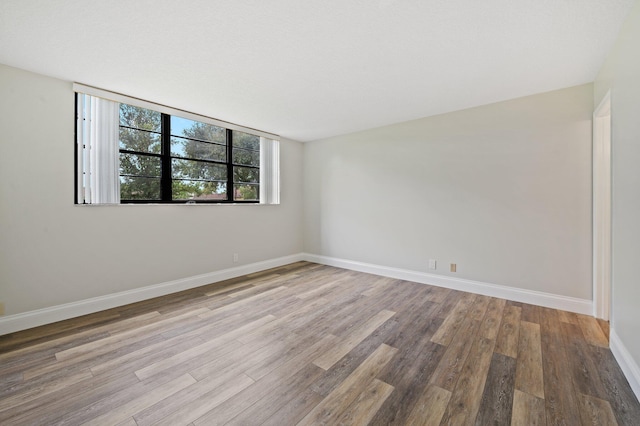 unfurnished room featuring light hardwood / wood-style flooring