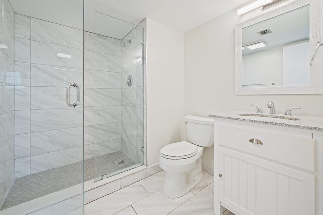 full bathroom with combined bath / shower with glass door, vanity, and toilet