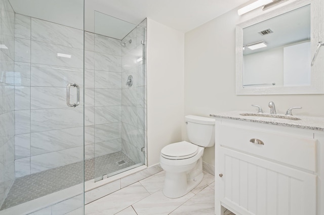 bathroom featuring vanity, toilet, and an enclosed shower