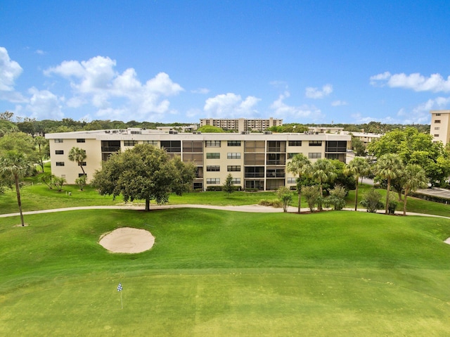 view of home's community with a lawn