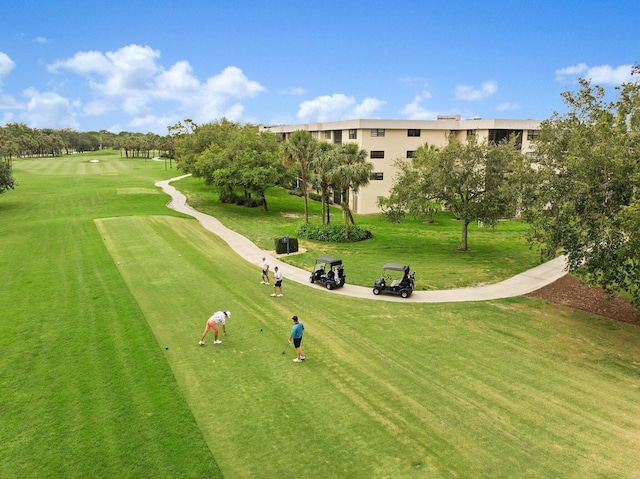 view of property's community featuring a yard