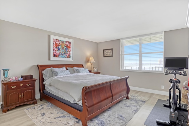 bedroom with light wood-type flooring