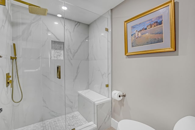 bathroom featuring toilet and walk in shower