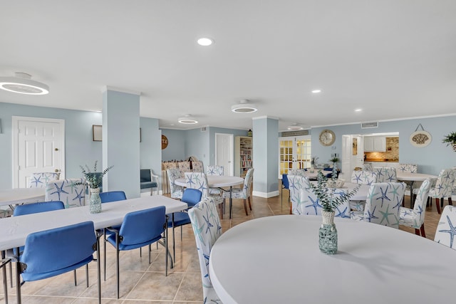 dining space featuring light tile patterned flooring