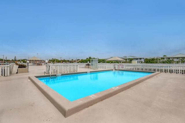 view of pool featuring a patio