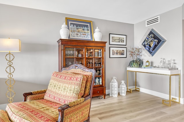 sitting room with hardwood / wood-style floors